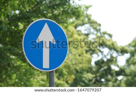 Traffic sign of the arrow of the Japanese road of the day when it was fine                               