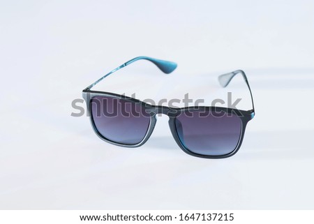 Stylish sunglasses on the desk Royalty-Free Stock Photo #1647137215