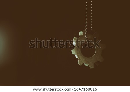  hang on a chain on a black background