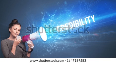Young person shouting in loudspeaker with CREDIBILITY inscription, business concept