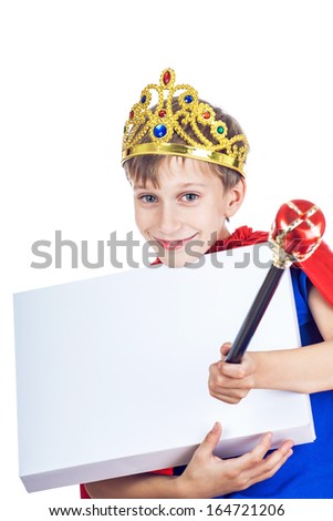 Beautiful cheerful child dressed as king with a crown holds a rectangular white board with space for text giving an order (important customer concept)