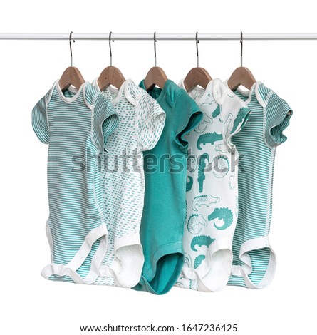 Baby bodysuit hanging on sholders isolated on white background/ Close-up/ Baby clothes Royalty-Free Stock Photo #1647236425