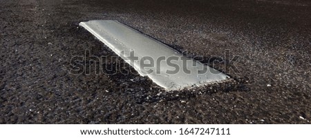 fresh road marking of their plastic on asphalt
