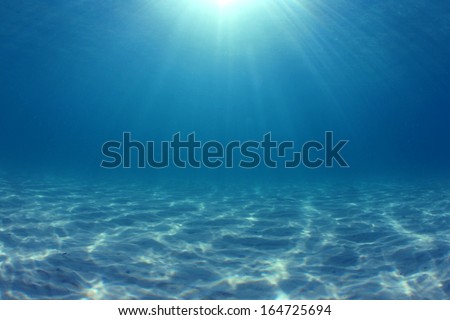 Underwater Background: Sunbeams in ocean