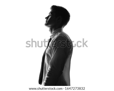 Confident silhouette portrait of young man. Business of office worker concept. Isolated white background.