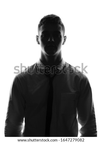 Silhouette portrait of young business man in white shirt. Office worker concept. Isolated white background.