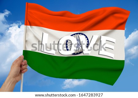 photo of the beautiful colored national flag of the modern state of India on textured fabric, concept of tourism, economics and politics, closeup