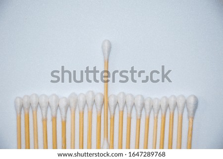 Sticks for cleaning ears, on a light background.