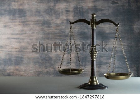 Law and Justice concept. Mallet of the judge, books, scales of justice., place for typography. Courtroom theme.. Wooden rustic background