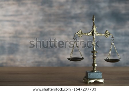 Law and Justice concept. Mallet of the judge, books, scales of justice., place for typography. Courtroom theme.. Wooden rustic background