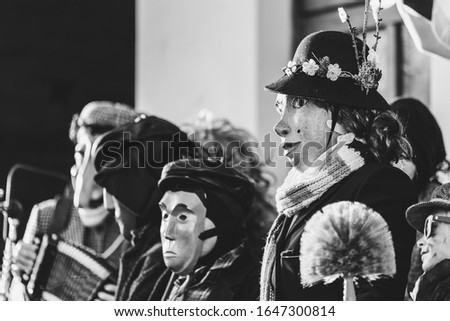 Ancient carnival of Sauris. Traditional wooden masks. Black and white. Italy