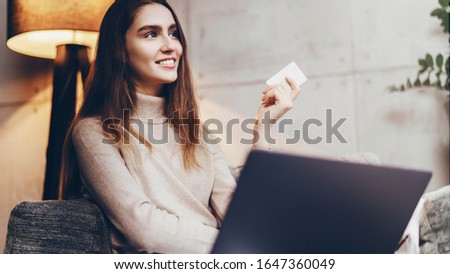Girl using bank card for buying things online. Retail stores offering bonus cards for customers. Select items in web shop app, transfer money safely using sms code for payment. Money refund guarantee. Royalty-Free Stock Photo #1647360049