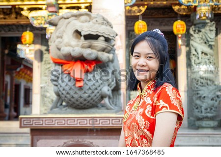 Portrait asian woman in Chinese national costume,  of Chinese New Year Celebration concept.