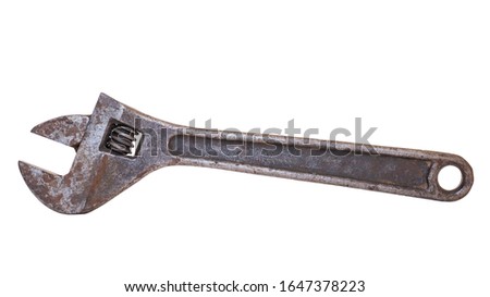 Old adjustable wrench on a white background close-up. Isolate.