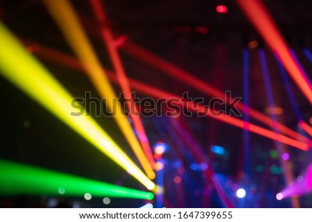 Scene, stage lights with colored spotlights and smoke, laser lights background, rainbow colors, LGBT or LGBTQ social movements Royalty-Free Stock Photo #1647399655