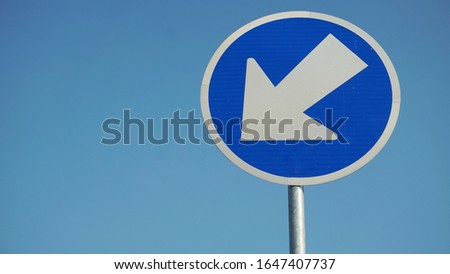 Keep left sign against the sky cloud background

