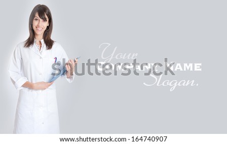 Standing young medical worker holding a folder 