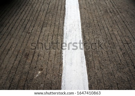 An Empty Road With Single Solid White Line Road Marking.  Parking Car Area.                            