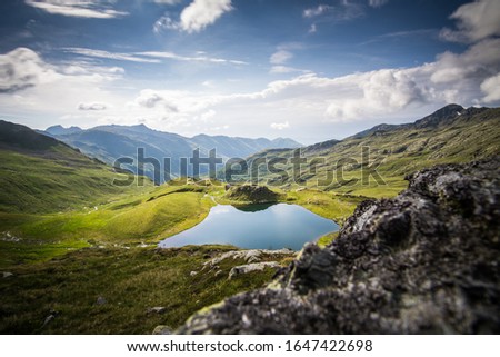 Long time exposure of a small lake in the "Kreuzeck-Gruppe", an area in the austrain alps. Due to the use of the ND-filter the picture has a "quiet" feeling Royalty-Free Stock Photo #1647422698