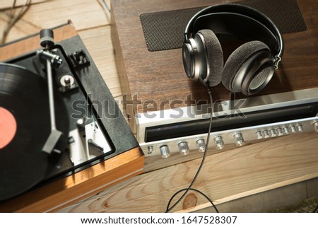 HiFi system with turntable, amplifier, headphones and lp vinyl records in a listening room Royalty-Free Stock Photo #1647528307
