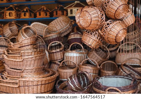 Different size and shapes of traditional handmade baskets in street souvenir shop in Germany. Close up, selective focus.