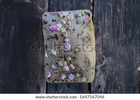 
frozen flower on wooden background