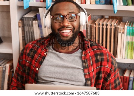 African-American student preparing for exam in library