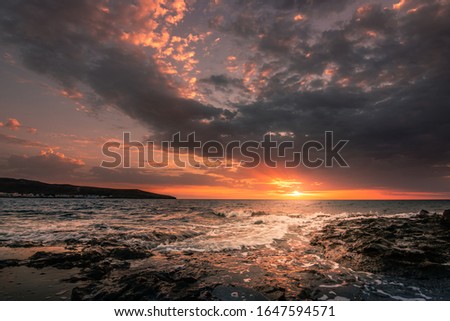beautiful sunrise or sunset over the sea.  great colors and romantic mood complete the picture.  recorded on Fuerteventura canarias spain in Europe