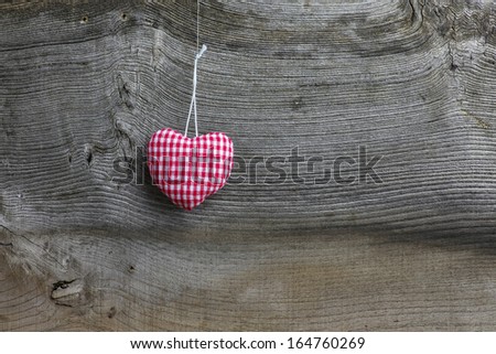 Christmas handmade decoration gingham fabric hearth over rustic Elm wood background - retro style design, copy space