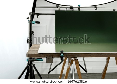 Interior of photo studio and empty space on paper for your product.Dark mood photo and copy space for your decoration. 