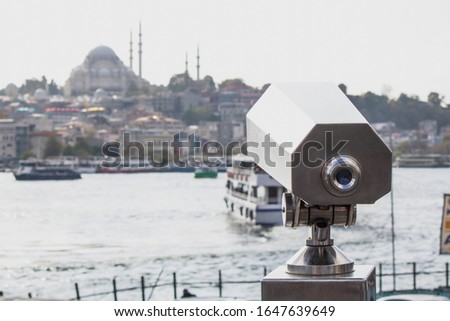 Landscape binocular close-up. Silhouette of mosque in the background. Photographed at Istanbul Karakoy Beach.