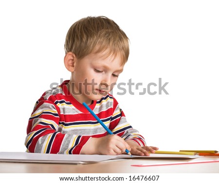 Young boy studies to draw