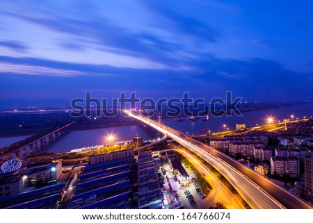 Night view of the bridge and city in shanghai china.