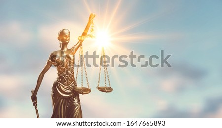 Statue of Justice lady on sky background