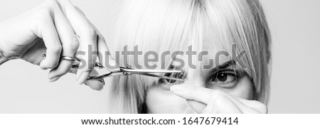 Blonde girl cut forelock. Close up hairstyle with bangs. Hair care concept Royalty-Free Stock Photo #1647679414