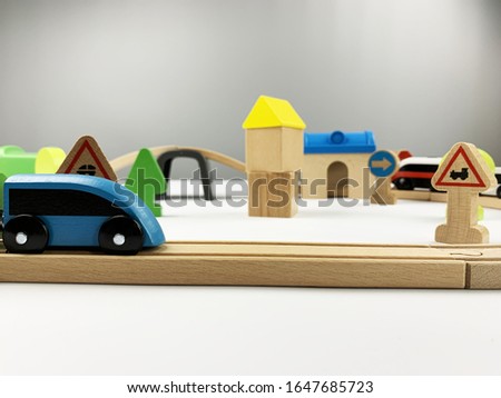 children's wooden railway on a white and gray background