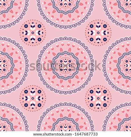 Ethnic floral ornament. Seamless pattern with abstract flowers on pink background.