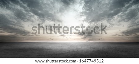 Dramatic Floor Background Scene with Dark Cloud Horizon Sky