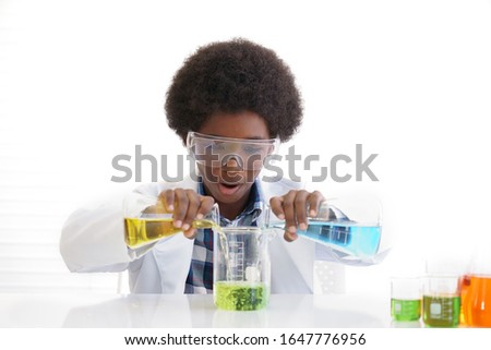 African American boy testing chemistry lab experiment Royalty-Free Stock Photo #1647776956