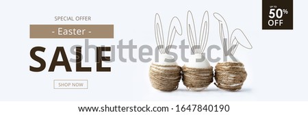Easter sale banner with easter eggs and rabbit ears.