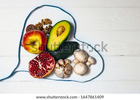 Products useful for the heart with a centimeter on a white background.