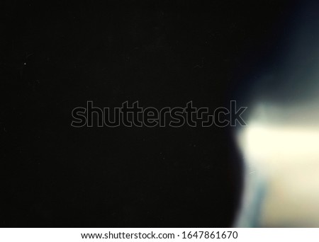 Abstract light effect on black background. Vintage.Grain texture. Mask 00s