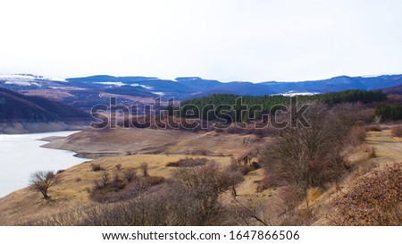 The landscape of the reservoir, and around a deserted beach and forests. Algeti reservoir. Royalty-Free Stock Photo #1647866506