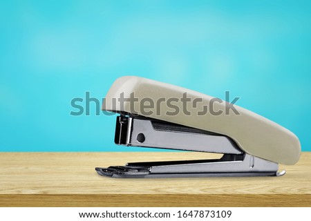 Office accessory stapler on wooden desk