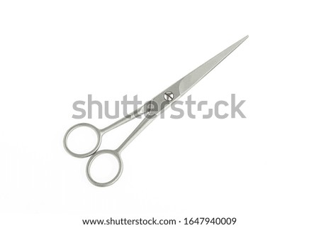 Scissors on white single background