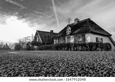 a old farm on a Dutch dike in black and white