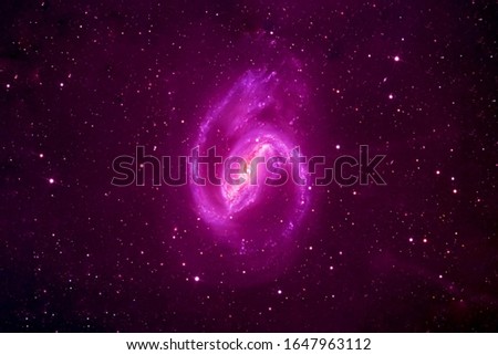 Galaxy spiral in pink color. Elements of this image were furnished by NASA.