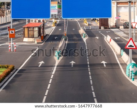Photo of empty lanes on highway and blank road signs. Place for your text. Copy space