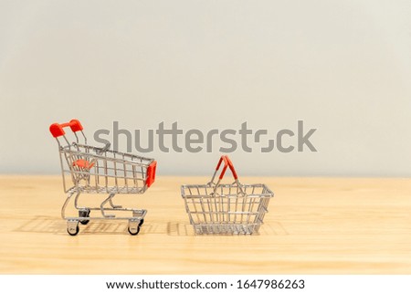close-up of shopping cart and on vintage retro background with some copy space for texting.