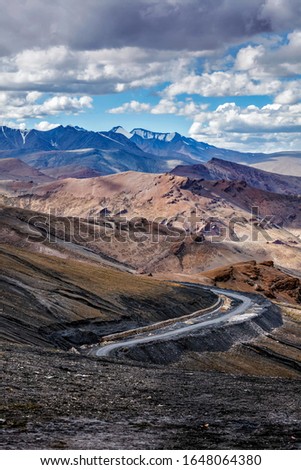Manali-Leh Highway road from Himachal to Ladakh. Beautiful Indian Himalayan landscape is on the way from Kullu valley to Jammu and Kashmir state. Earthroad highway is more than 400 km. North India Royalty-Free Stock Photo #1648064380